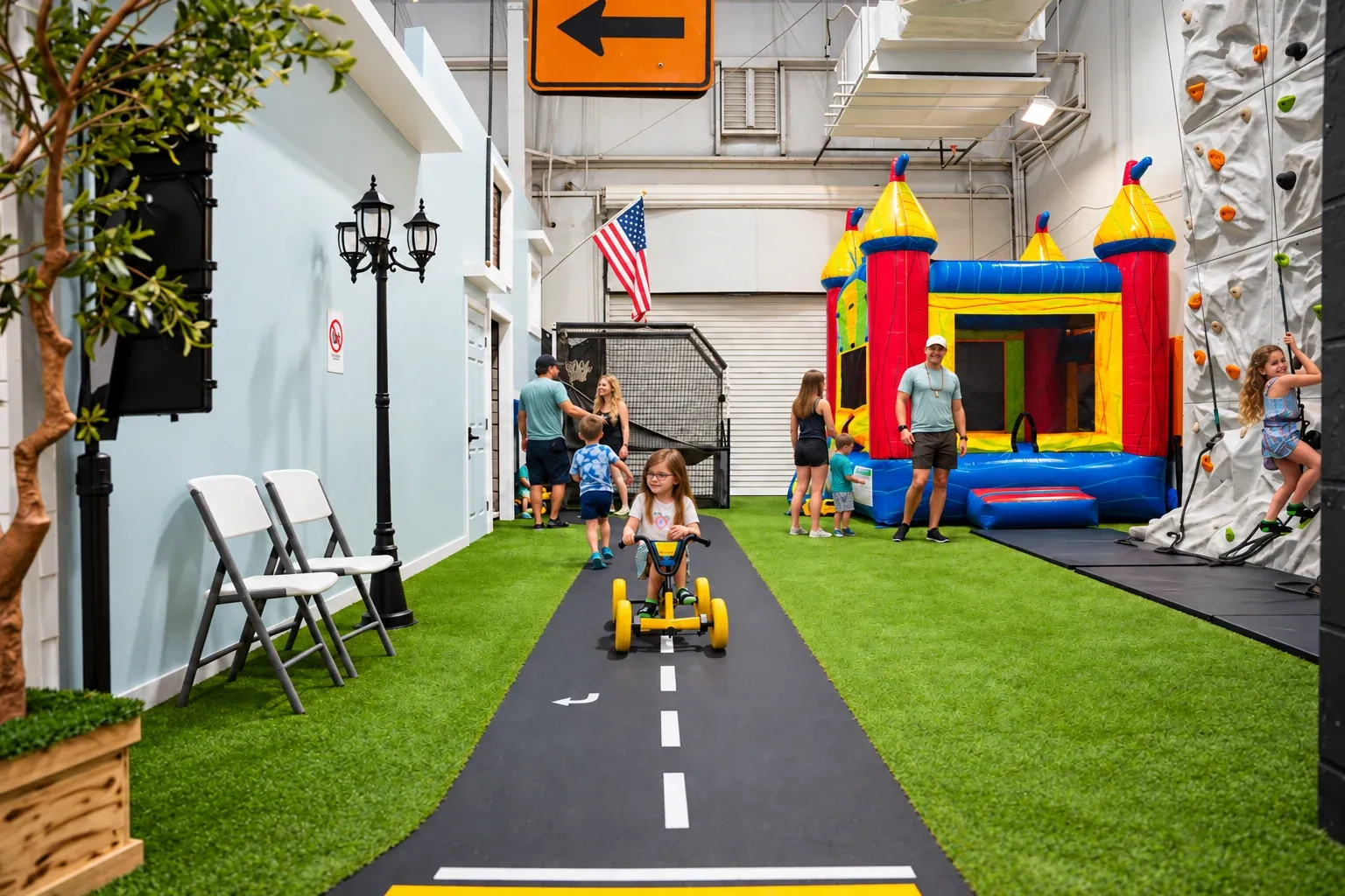 Colorful indoor bounce house beside Fort Rock’s miniature play street.