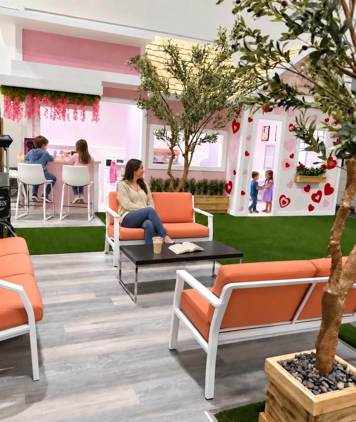 Parent seating and children at the pretend café counter