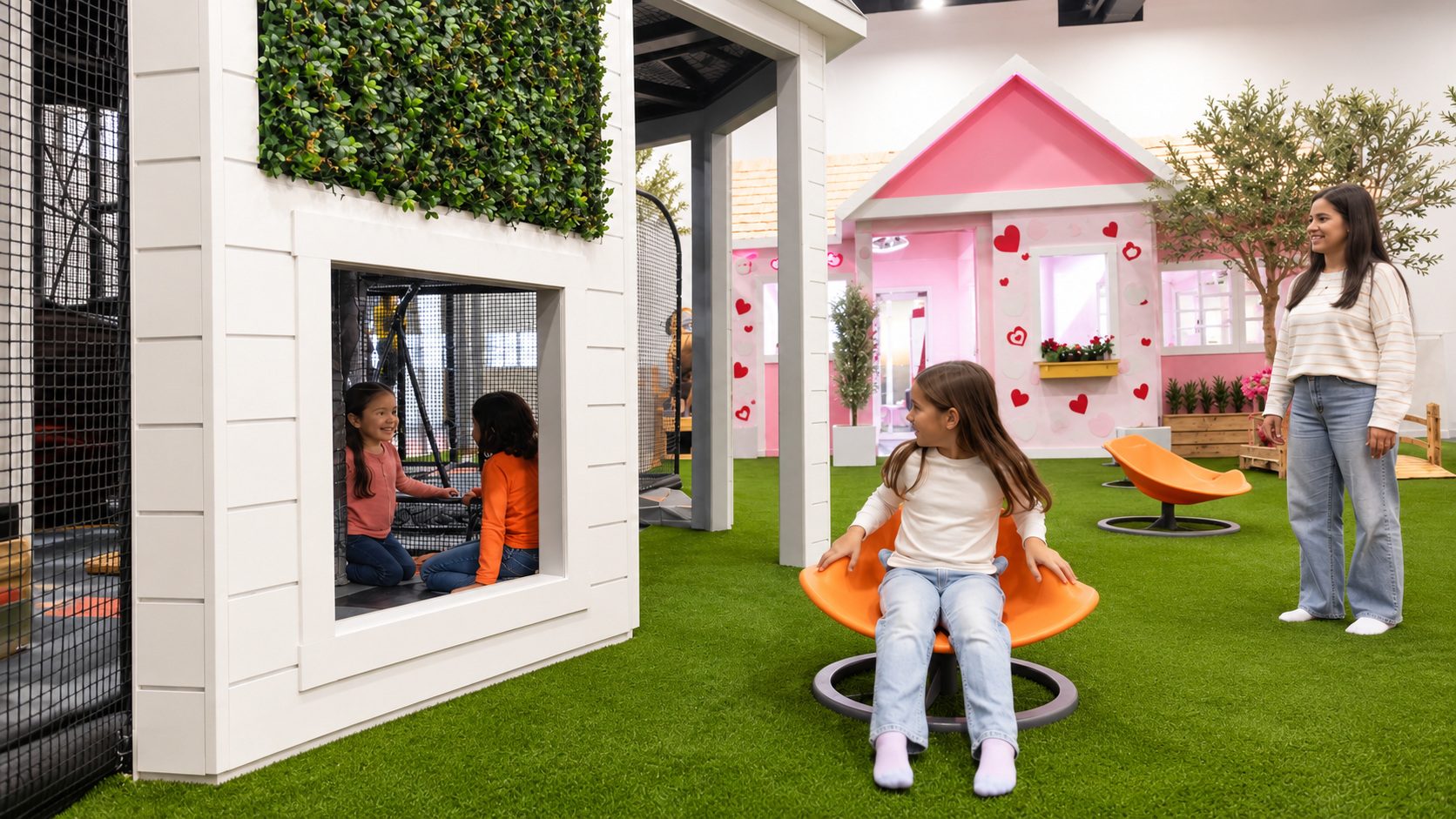 Children using the white playhouse and orange spinning seat while a parent watches nearby