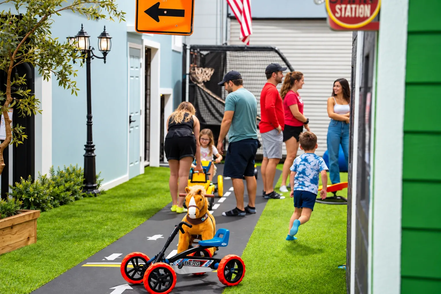 Pedal cars and a ride-on horse along Fort Rock’s miniature play street.